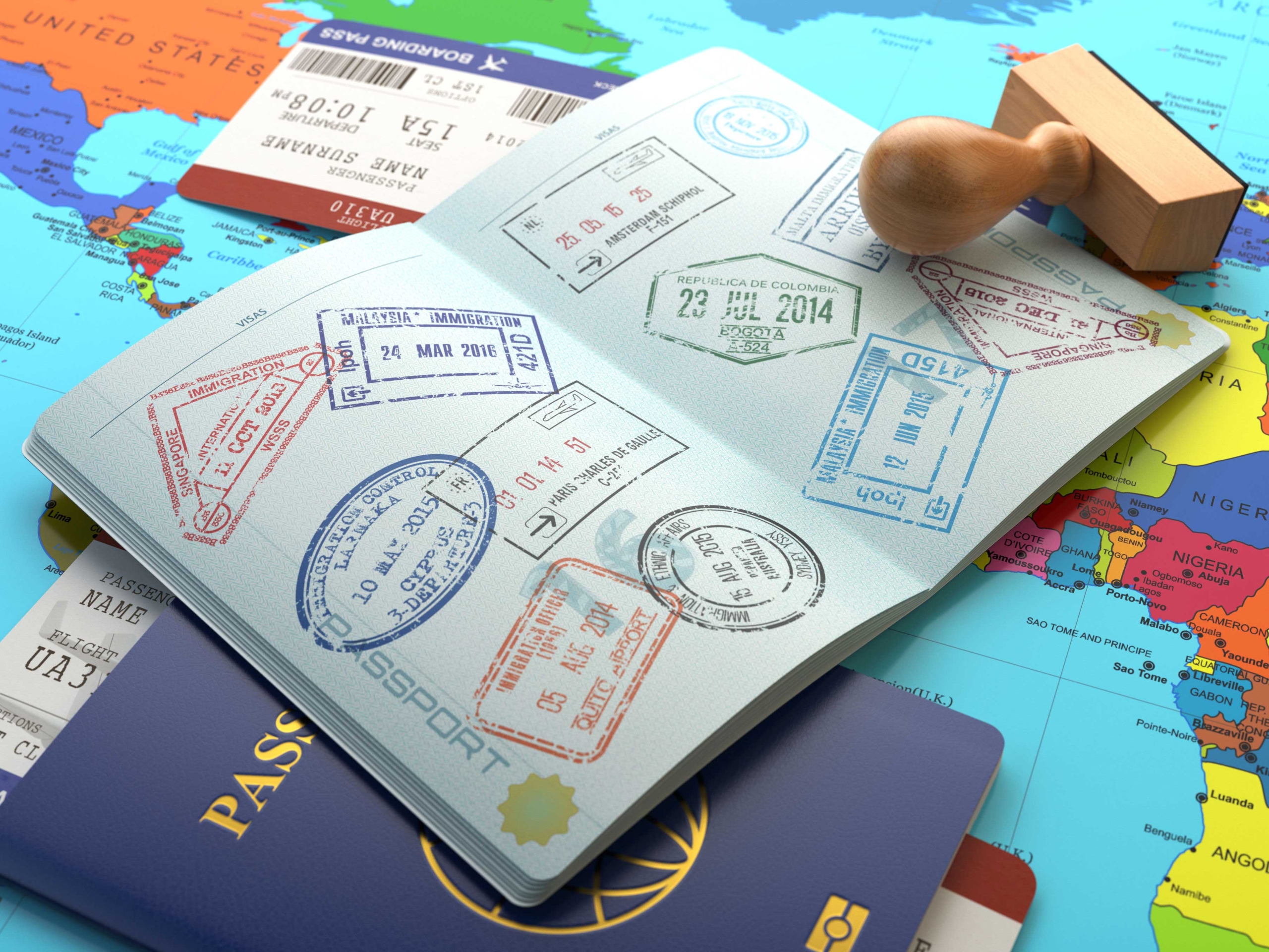 A stock image showing a passport with several stamps